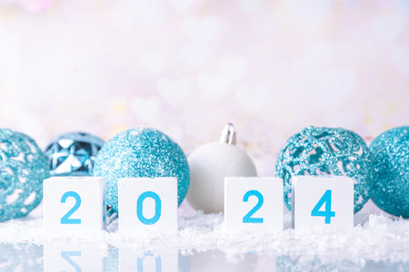 Christmas New Year background with wooden calendar 2024, with holiday decorations and artificial snow, copy spaceの写真素材