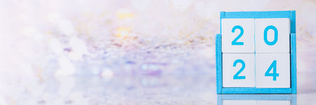 Christmas New Year background with wooden calendar 2024, with holiday decorations and artificial snow, copy spaceの写真素材