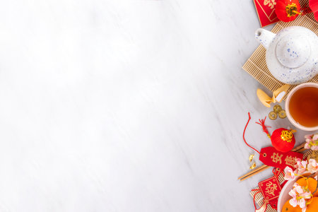 Chinese New Year theme background with copy space. Red fans, gold coins, tangerines, cherry blossoms, holiday golden branches, decor, wishes envelopes. gold dragon on white backgroundの写真素材