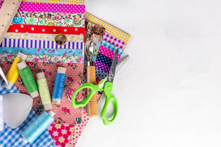 Sewing, needlework and clothing repair, background, scrapbooking, quilting. Colorful pieces of...