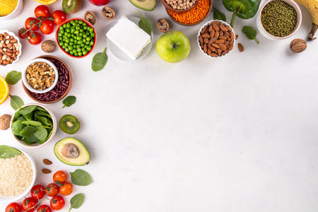 Portfolio Diet, balanced lowering cholesterol vegan food, including nuts, vegetable protein, plant sterols, viscous fiber, beans, legumes, fresh vegetables and fruits on white background copy spaceの写真素材