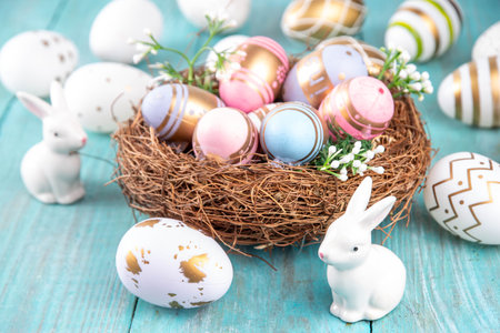 Easter nests and eggs background with spring flowers, Happy Easter holiday greeting card flat lay on wooden background, top view copy spaceの写真素材