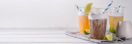 Dirty soda, soda and cream alcohol free mocktail. Iced sweet soda drink with non-dairy creamer,...