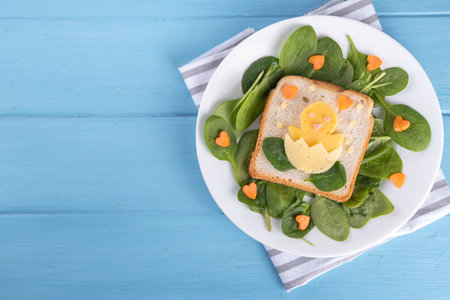 Creative homemade Easter sandwiches for kids breakfast. Funny sandwiches in form of Easter symbols -...