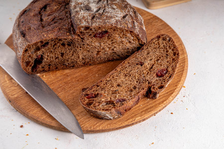 Homemade freshly baked sourdough bread. Craft homemade baked bread, rye and white, on a white table....