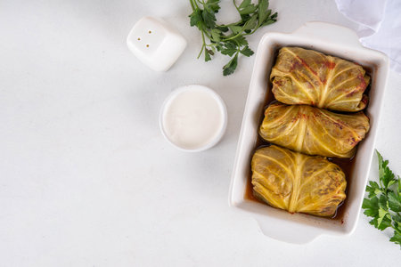 Homemade Stuffed cabbage rolls on white table. Cabbage rolls with meat or vegetables with rice, balanced healthy food recipeの写真素材