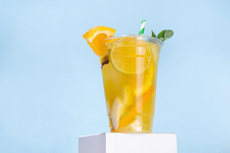 Orange coconut lemonade mojito drink, summer iced cocktail, mocktail with fresh fruit and juicesの写真素材