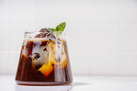 Coffee Jelly Dessert made with strong espresso coffee, gelatin or agar and whipped cream. Asian cold...