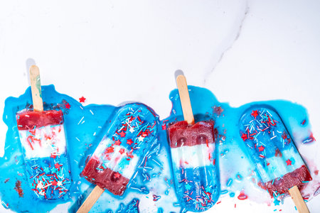 Red, white and blue ice pops.  Patriotic USA lollypops ice cream for july 4 party or bbq picnic, tasty popsicles with fruit berry flavoursの写真素材