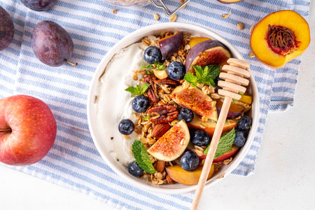 Healthy autumn breakfast bowl. Cottage cheese or yogurt with granola, nuts and fall seasonal fruits,balanced comfort food snack for morning and lunch, copy spaceの写真素材