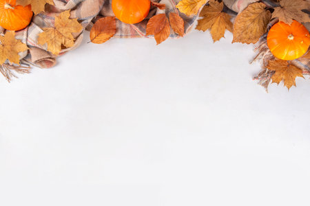 Minimal sparse autumn background with fall leaves top view copy spaceの写真素材