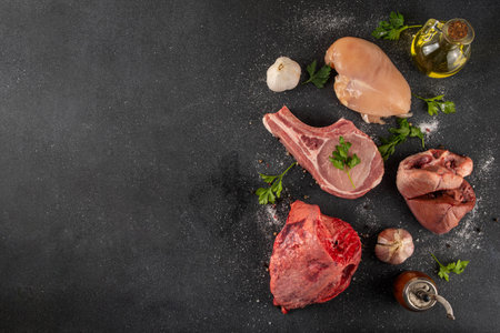 Protein carnivore diet, animal protein different sources - raw meat, liver, chicken, offals, heart, liver, lungs, alternative budget inexpensive sources of animal proteinの写真素材