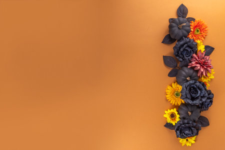 Dia de los muertos Feast flat lay, Mexican Day of the Dead holiday background with fall black, orange, yellow flowers, lightbox with text Dia de los muertos, colorful painted skullの写真素材
