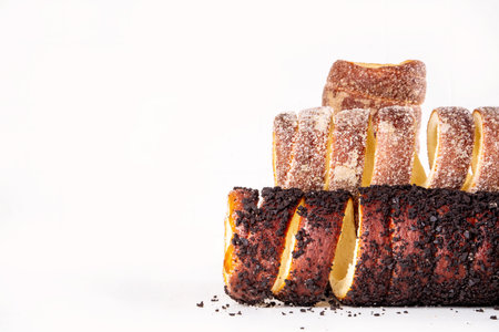 Traditional East Europe Christmas sugar glazed dessert chimney cake, trdlo or trdelnik, sweet aromatic winter seasonal street food with cinnamon and spicesの写真素材