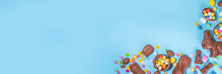 Easter chocolate egg and bunny background. High-colored flat lay with chocolate bunny and rabbits,...
