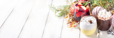 Hot drink cafes menu background, with mulled wine, eggnog and hot chocolate traditional Christmas winter cocktails and beverages, with Christmas New Year festive holiday decorations, copy spaceの写真素材
