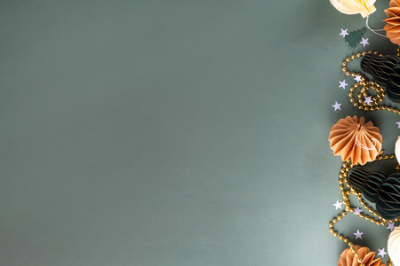 Christmas flat lay background in cozy nordic hygge style, Composition with traditional Scandinavian paper honeycomb ornaments, gift boxes, golden garland. Modern trendy eco Christmas decorの写真素材