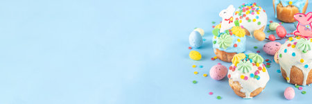 Bright colorful Easter cakes, pastries and eggs greeting card background with copy space,  Easter cooking concept, sweet treats sale, Easter party, spring baking fair invitationの写真素材