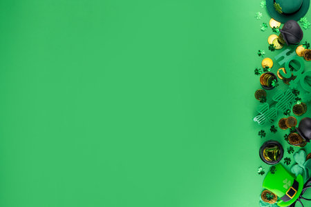 Shamrock saint patrick's day background, St. Patrick's holiday flat lay with party accessories, decor, pot of gold coins, leprechaun's hat, eyeglasses, lucky horseshoe, confetti on green backgroundの写真素材