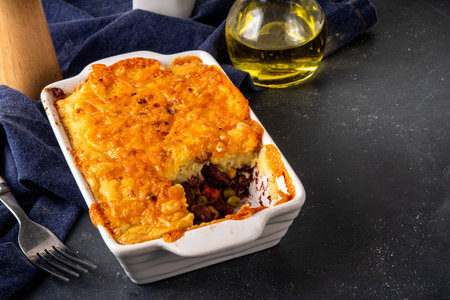Vegan Sheppard Pie Recipe. Traditional English pie with mashed potatoes, with base of legumes, beans and corn instead of meat. Vegan source of protein, balanced lunch or dinner ideaの写真素材