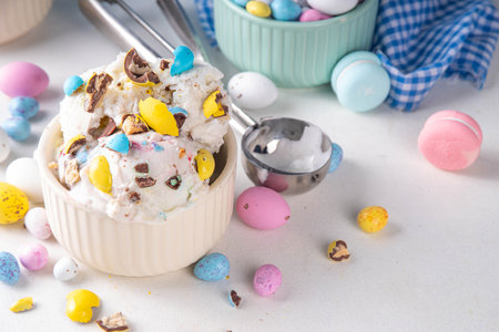 Easter egg ice cream, bowl of vanilla gelato with crushed chocolate mini eggs, sweet dessert treat for Easter holiday party or snackの写真素材
