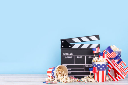 Memorial Day, Independence Day Fourth of July movie marathon, for American holidays, Movie Night party. Cinema clapper-board, Popcorn in Patriotic Cup,  American flag  decoration, accessories, glassesの写真素材
