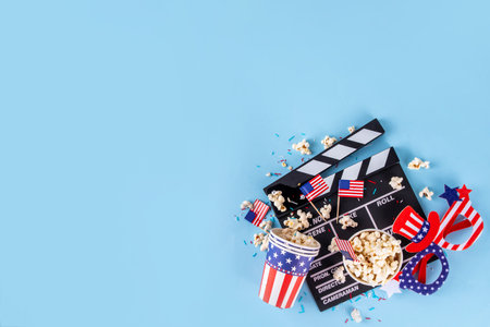 Memorial Day, Independence Day Fourth of July movie marathon, for American holidays, Movie Night party. Cinema clapper-board, Popcorn in Patriotic Cup,  American flag  decoration, accessories, glassesの写真素材