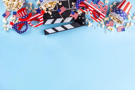 Memorial Day, Independence Day Fourth of July movie marathon, for American holidays, Movie Night party. Cinema clapper-board, Popcorn in Patriotic Cup,  American flag  decoration, accessories, glassesの写真素材