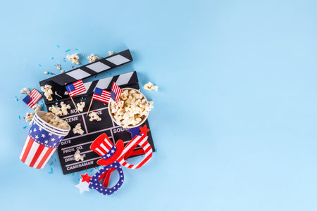 Memorial Day, Independence Day Fourth of July movie marathon, for American holidays, Movie Night party. Cinema clapper-board, Popcorn in Patriotic Cup,  American flag  decoration, accessories, glassesの写真素材