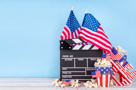 Memorial Day, Independence Day Fourth of July movie marathon, for American holidays, Movie Night party. Cinema clapper-board, Popcorn in Patriotic Cup,  American flag  decoration, accessories, glassesの写真素材