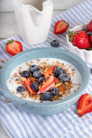 Sweet Homemade Breakfast, Greek Yogurt bowl with Granola and Berriesの写真素材