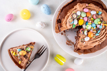 Easter Egg Nest Chocolate Cake. Sweet Easter cake with crushed chocolate eggs, traditional holiday baking recipe idea, on festive decorated table copy spaceの写真素材