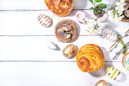 Easter background with baking cruffin pandoro pannetone cake, with colorful painted Easter eggs. Happy Easter greeting card backgroundの写真素材