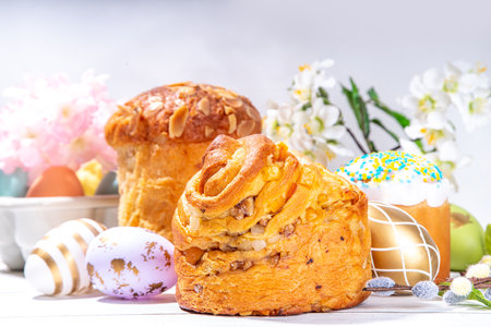 Easter background with baking cruffin pandoro pannetone cake, with colorful painted Easter eggs. Happy Easter greeting card backgroundの写真素材