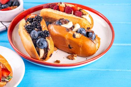 Sweet summer fruit berry breakfast with chocolate spread, various fruit, blueberry, raspberry, strawberry, blackberry, nutsの写真素材