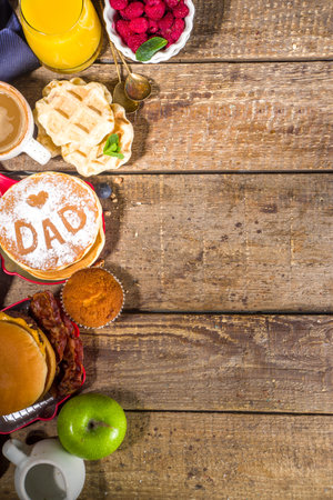 Fathers day Brunch restaurant invitation concept. Various Daddy Man Day Menu background, with traditional breakfast and lunch food set, with tie on sunny wooden backgroundの写真素材