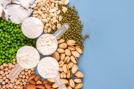 Various source vegan protein powders. Vegetarian plant based protein shakes powder and ingredient for it - green peas, soybeans, almonds, pistachios, peanuts, coconut, legumes.の写真素材