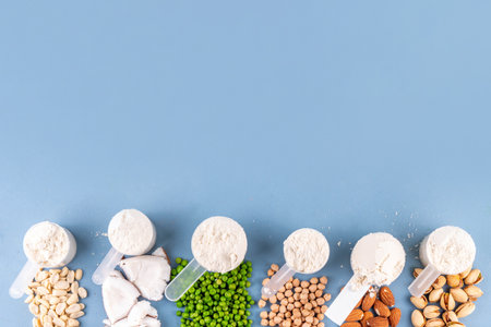 Various source vegan protein powders. Vegetarian plant based protein shakes powder and ingredient for it - green peas, soybeans, almonds, pistachios, peanuts, coconut, legumes.の写真素材