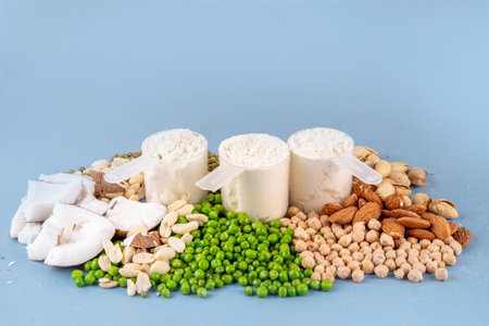 Various source vegan protein powders. Vegetarian plant based protein shakes powder and ingredient for it - green peas, soybeans, almonds, pistachios, peanuts, coconut, legumes.の写真素材