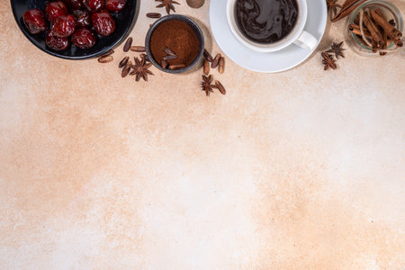 Healthy organic date seed coffee, black coffee cup, made with grated date seeds, with whole date fruits and seeds on beige background . Alternative coffee hot drinkの写真素材