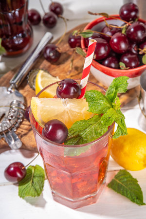 Summer cold refreshment cocktail with cola cherry juice. Cherry cola lemonade or mojitoの写真素材