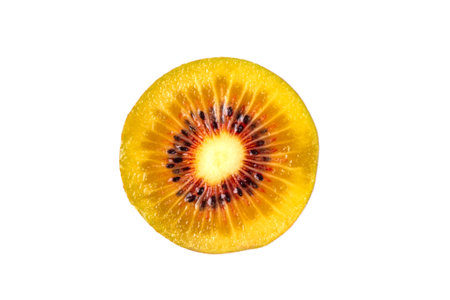 Sweet bright red colored kiwi fruits, whole and sliced, on kitchen table copy spaceの写真素材