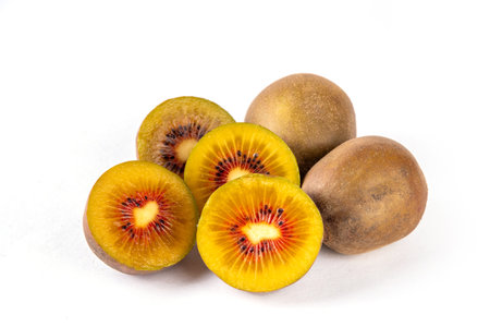 Red kiwi, Sweet bright red colored kiwi fruits, whole and slicedの写真素材