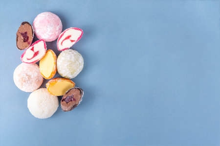 Various colorful fruit and berry mochi assortment. Traditional Japanese ice cream mochi, sweet dessert in rice dough, copy spaceの写真素材