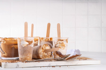 Dalgona coffee popsicle ice cream, Whipped instant coffee espresso gelato on stick, homemade frozen korean dalgona coffee dessertの写真素材