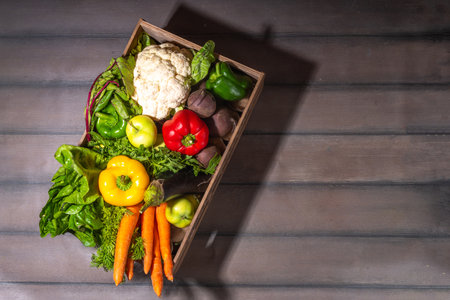 Farm organic market shopping concept, Wooden box with summer, autumn raw vegetables and fruitsの写真素材