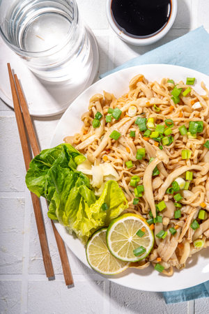 Asian shimeji noodles dish. Chow Mein noodles pasta, with stir fried vegetables, soy sauce and shimeji mushroomsの写真素材
