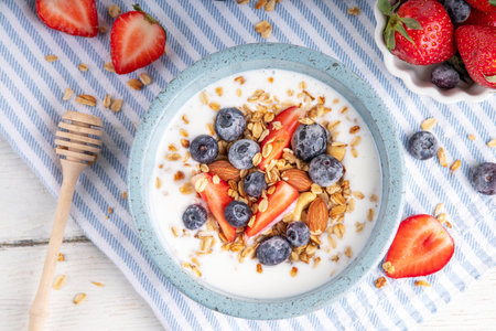 Sweet Homemade Breakfast, Greek Yogurt bowl with Granola and Berriesの写真素材