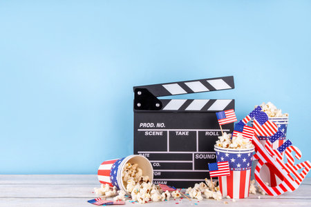 Memorial Day, Independence Day Fourth of July movie marathon, for American holidays, Movie Night party. Cinema clapper-board, Popcorn in Patriotic Cup,  American flag  decoration, accessories, glassesの写真素材