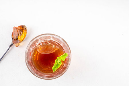 Black tea trendy asian dessert, diet non calorie sweet tea agar or gelatine jelly, in portioned glass, white table background copy spaceの写真素材